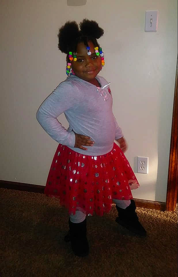 Ava is registered to the contest to win money with this photo: afro, ballet_tutu, clothing, costume, fun, joy, person, pink