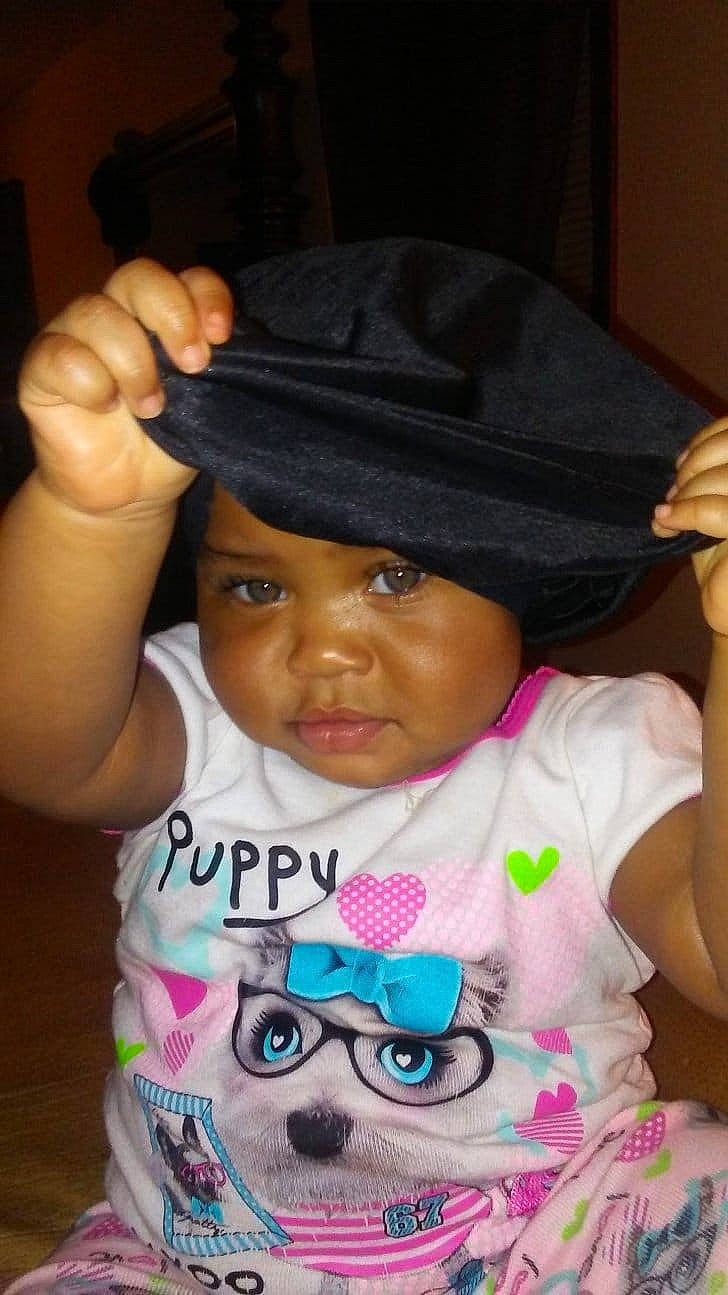 Ava joined the competition — help win amazing prizes! baby, black_hair, cheek, child, cool, fashion_accessory, fun, hand, hat, headgear, headwear, person, pink, play, smile, thumb, toddler