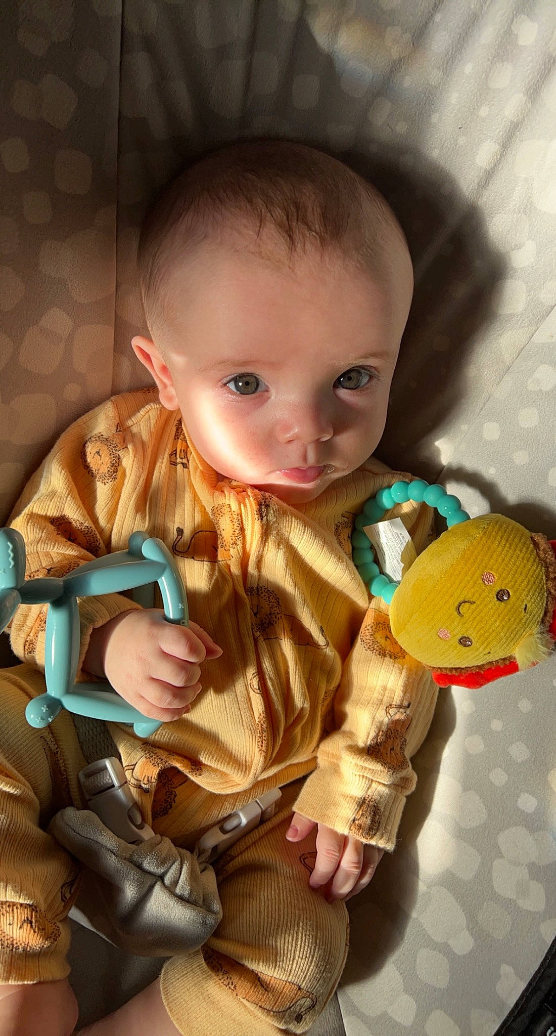 Everett is registered to the contest to win money with this photo: arm, baby, baby_products, baby_toddler_clothing, baby_toys, cheek, child, doll, figurine, fun, human_body, iris, nose, person, room, sitting, skin, stuffed_toy, toddler, toy