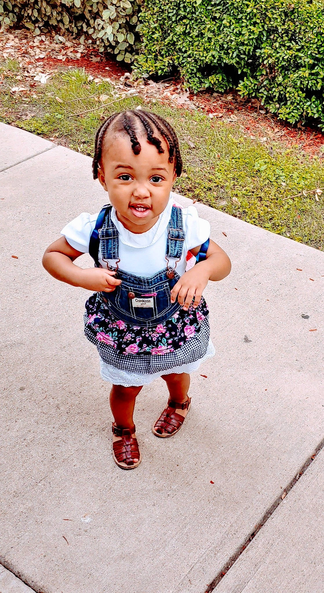 Alauna is registered to the contest to win money with this photo: baby, child, dress, face, facial_expression, footwear, grass, happy, head, nose, people, person, pink, play, shoe, skin, smile, summer, toddler, vacation