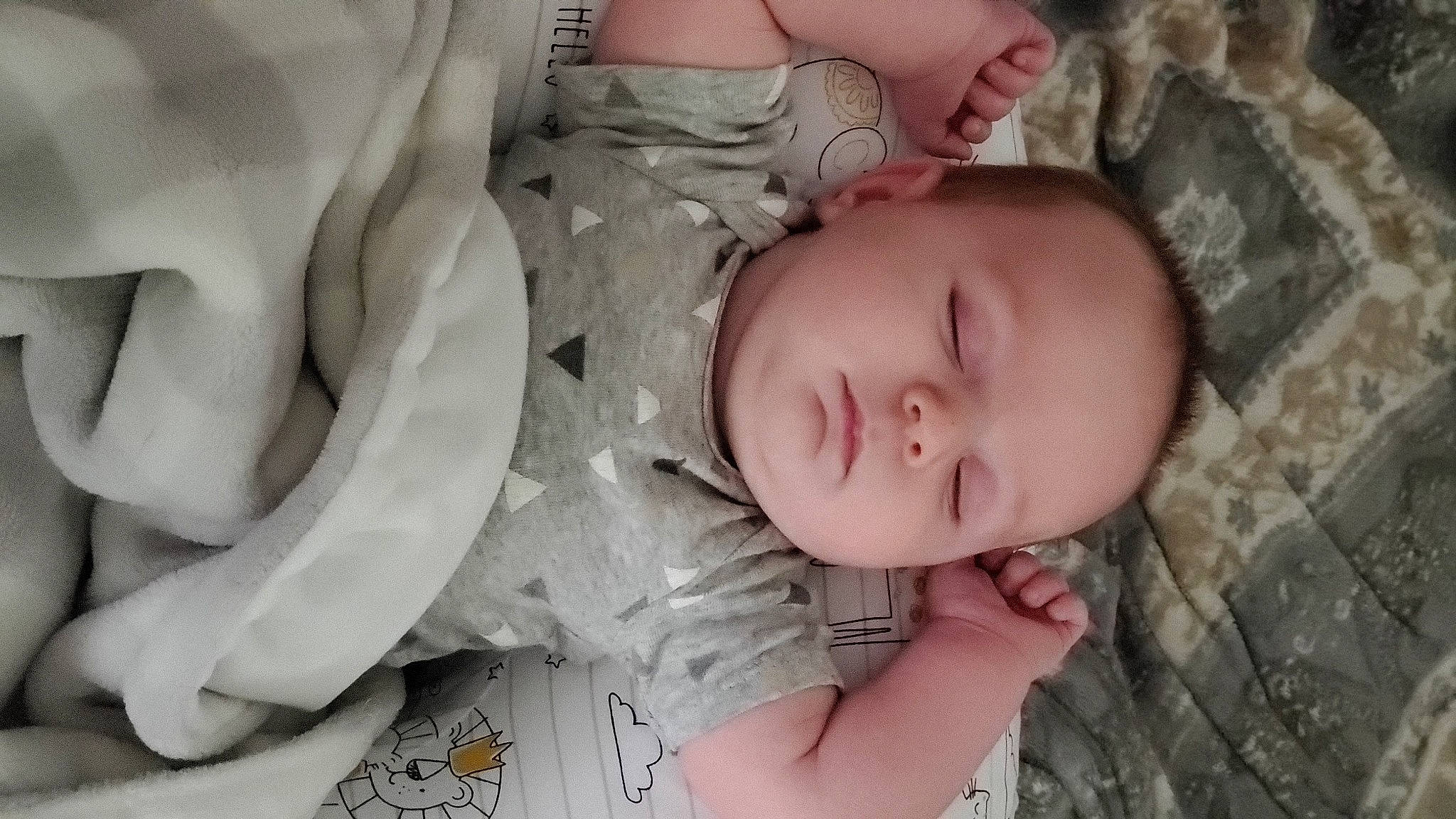 Nathan is registered to the contest to win money with this photo: arm, baby, baby_toddler_clothing, cheek, comfort, eye, eyelash, facial_expression, finger, hand, headgear, human_body, iris, lip, mouth, nose, organ, person, skin, sleeve