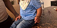 Isaiah joined the competition — help win amazing prizes! toddler, child, indoor, blue_shirt, denim_jeans, bib, knit_shoes, countertop, granite, adult, wooden_floor, painting, water_bottle, cabinet, person, home, curious, casual, portrait, expression