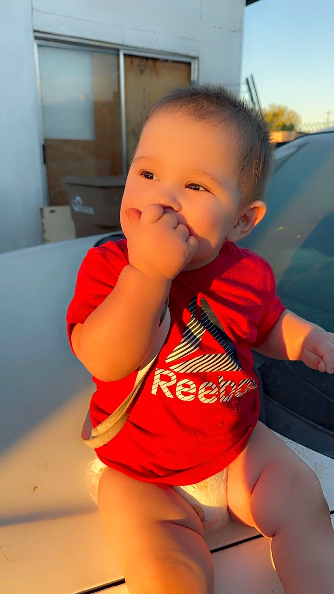 Camilo joined the competition — help win amazing prizes! baby_toddler_clothing, chin, eye, face, facial_expression, finger, fun, hairstyle, head, hood, leg, mouth, neck, person, skin, sleeve, smile, t_shirt, thigh, thumb