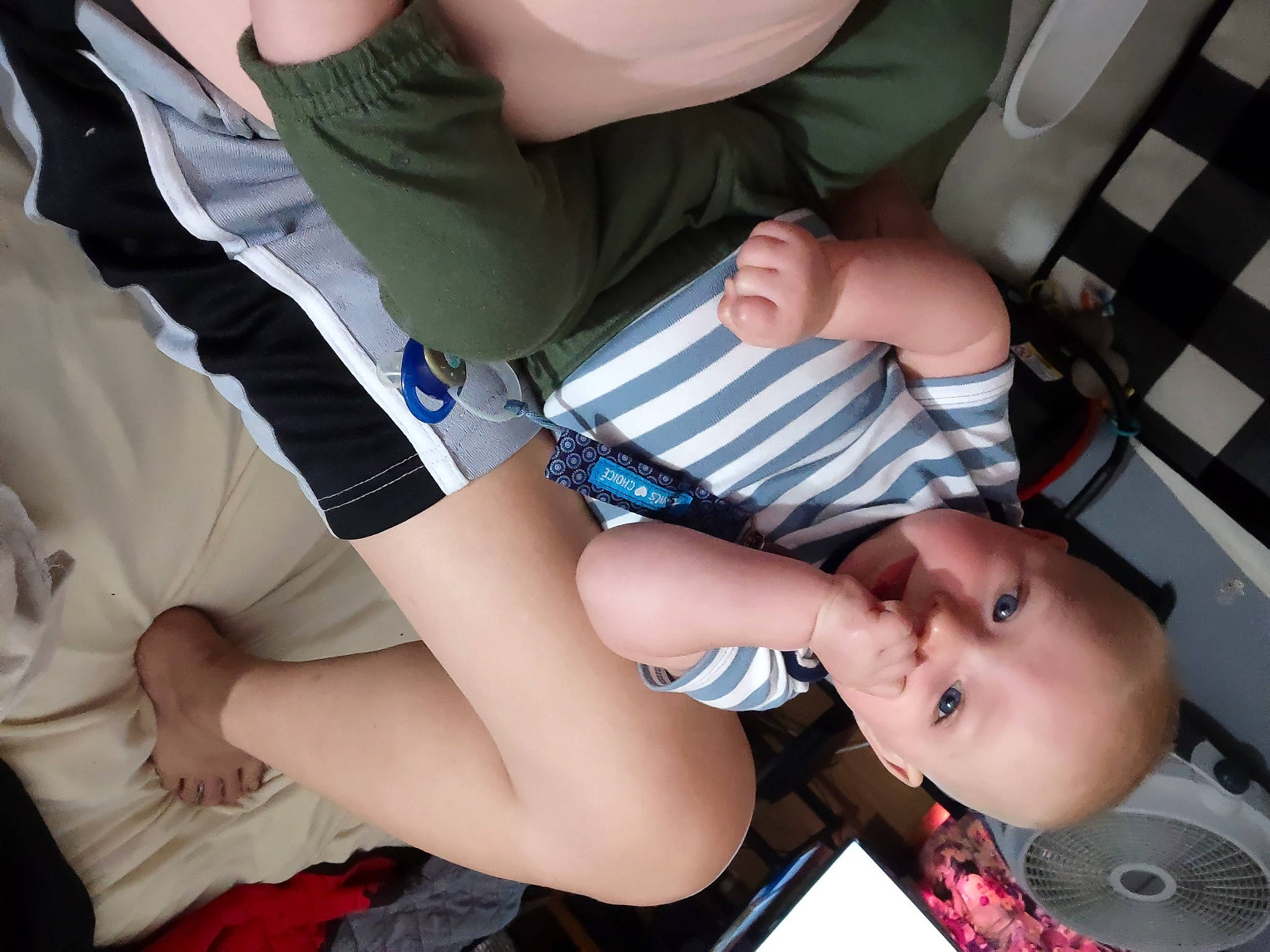 Donald is registered to the contest to win money with this photo: arm, baby, baby_products, baby_toddler_clothing, child, comfort, elbow, finger, fun, hand, human_leg, knee, lap, mouth, nail, person, skin, thigh, thumb, toddler