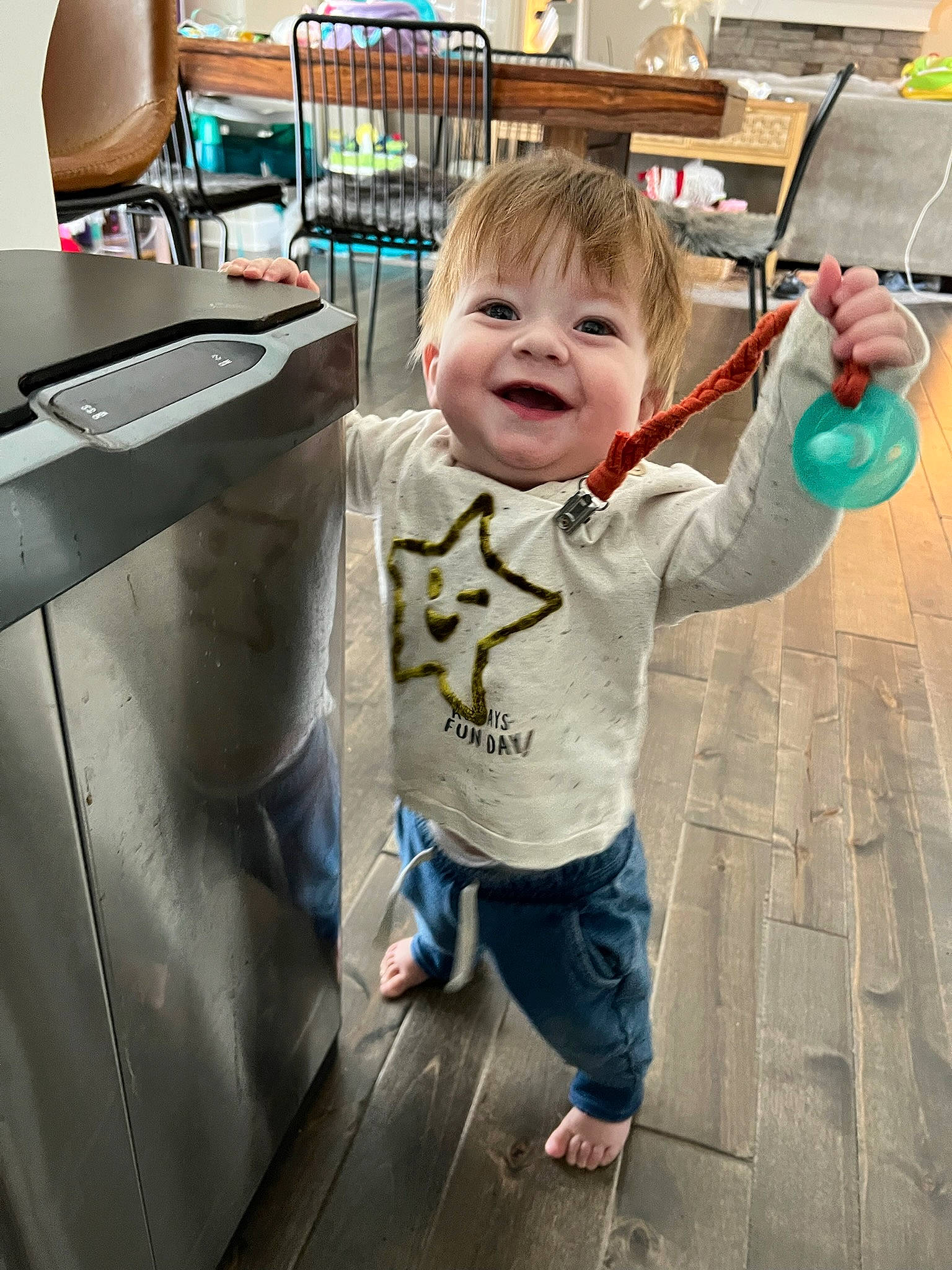 Jeremy is registered to the contest to win money with this photo: baby, baby_toddler_clothing, chair, child, flooring, fun, happy, joy, leisure, luggage_and_bags, person, play, room, sitting, smile, snapshot, t_shirt, toddler, travel, vacation