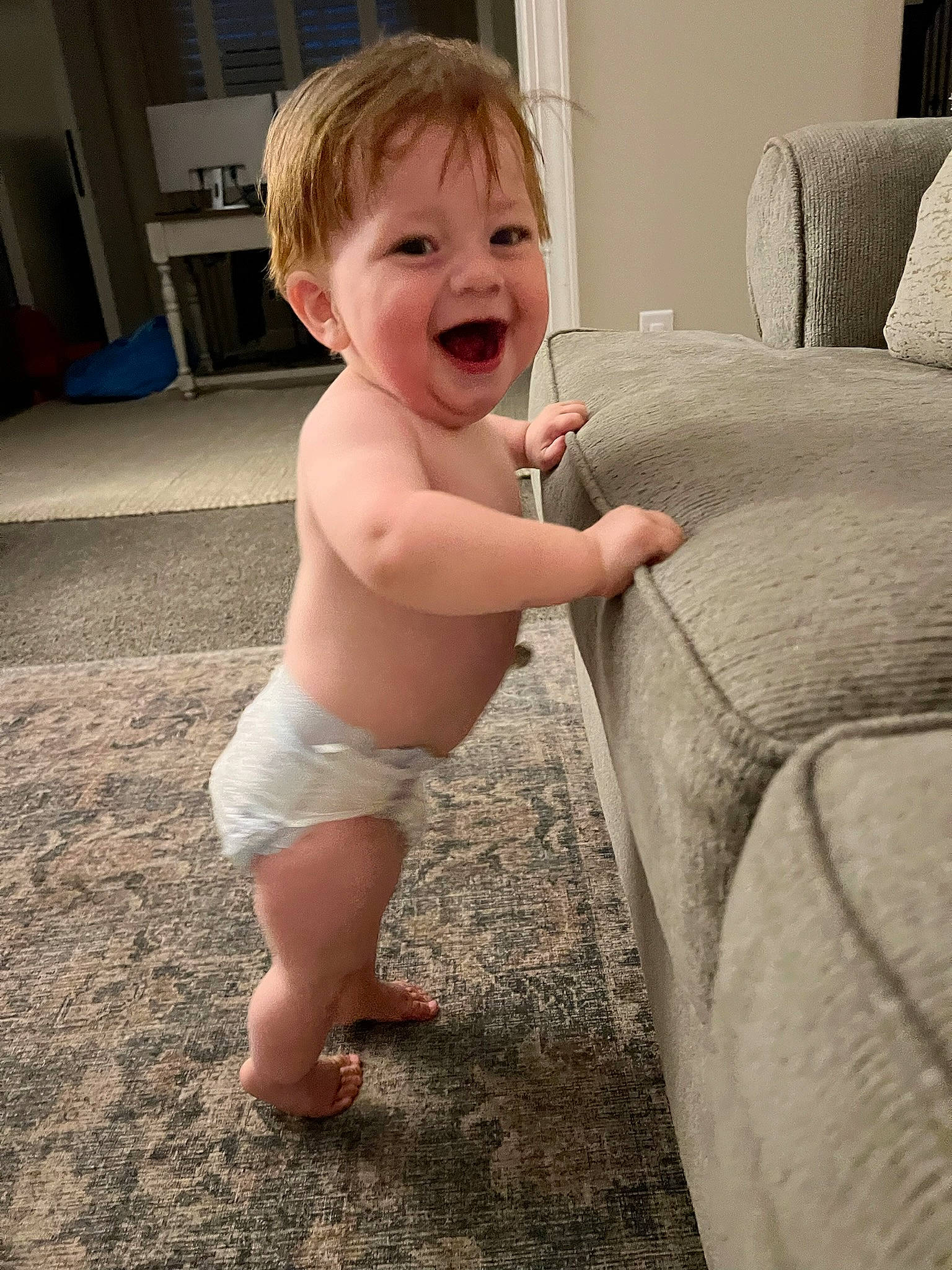 Jeremy is registered to the contest to win money with this photo: baby, baby_toddler_clothing, chest, child, comfort, couch, eye, face, floor, flooring, happy, human_leg, iris, leg, person, shoulder, smile, thigh, thumb, toddler