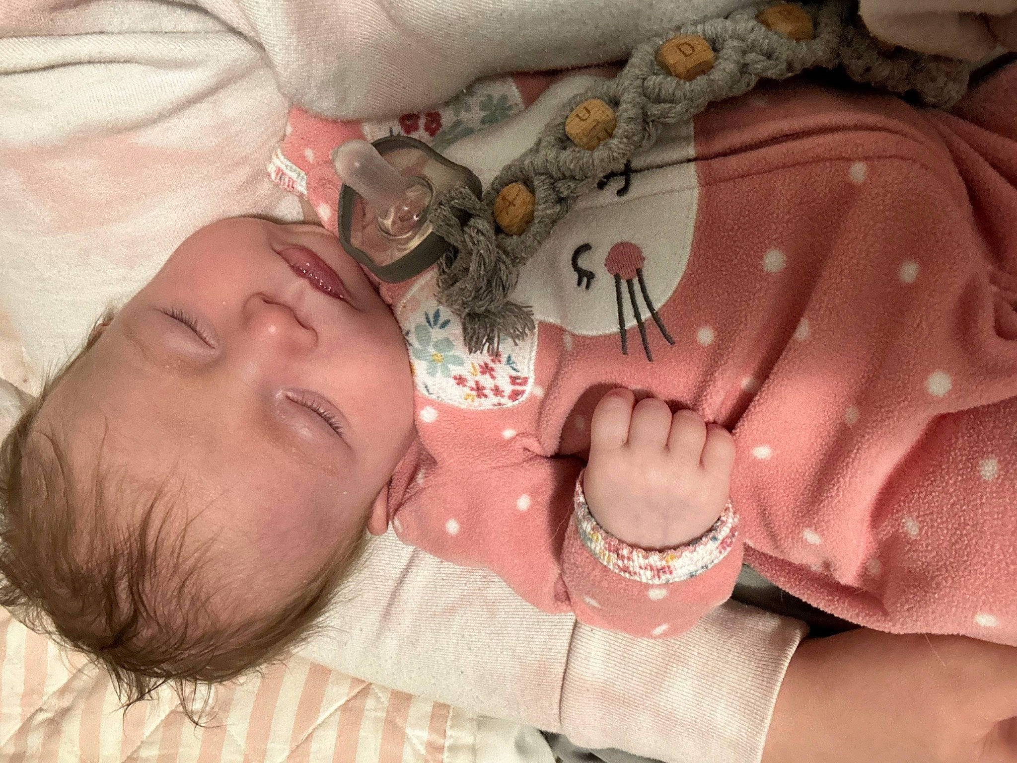 Audrey is registered to the contest to win money with this photo: baby, chest, child, comfort, eye, eyelash, finger, gesture, hand, head, jewellery, mouth, nail, neck, nose, pattern, person, skin, textile, toddler