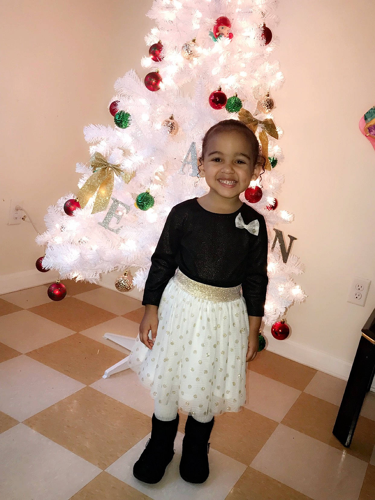 Nataleigh is registered to the contest to win money with this photo: child, christmas, christmas_decoration, christmas_eve, christmas_tree, costume, happy, holiday, interior_design, joy, outerwear, person, room, smile, standing, toddler, tree, white