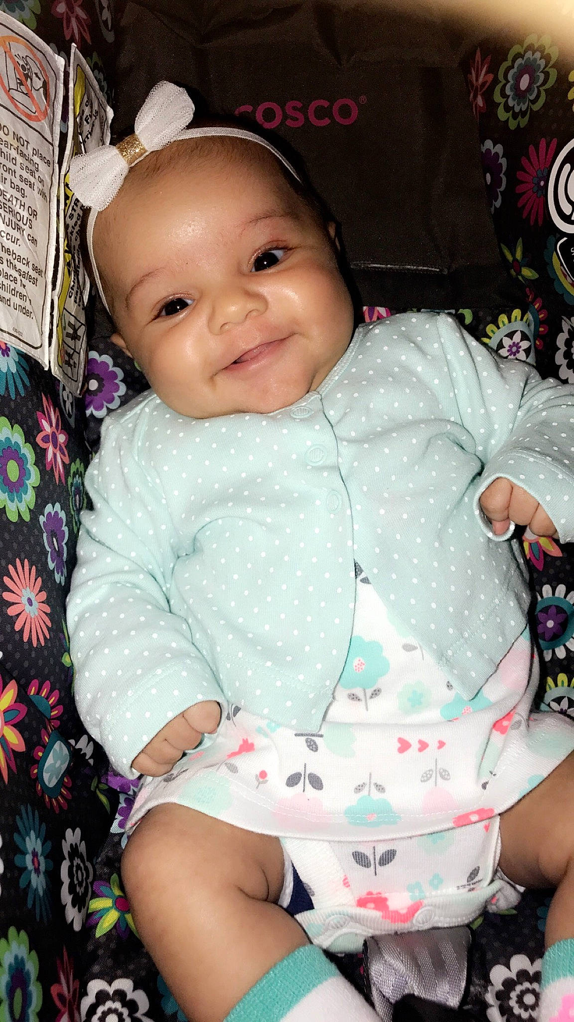 Emree is registered to the contest to win money with this photo: baby, baby_toddler_clothing, cheek, child, joy, person, pink, sitting, skin, smile, toddler