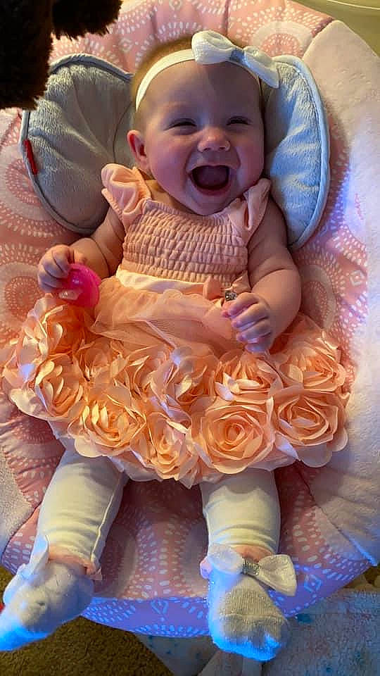 Khaleesi joined the competition — help win amazing prizes! abdomen, baby, baby_toddler_clothing, cheek, child, event, face, finger, flower, fun, happy, jewellery, mouth, person, pink, rose, sitting, skin, smile, toddler