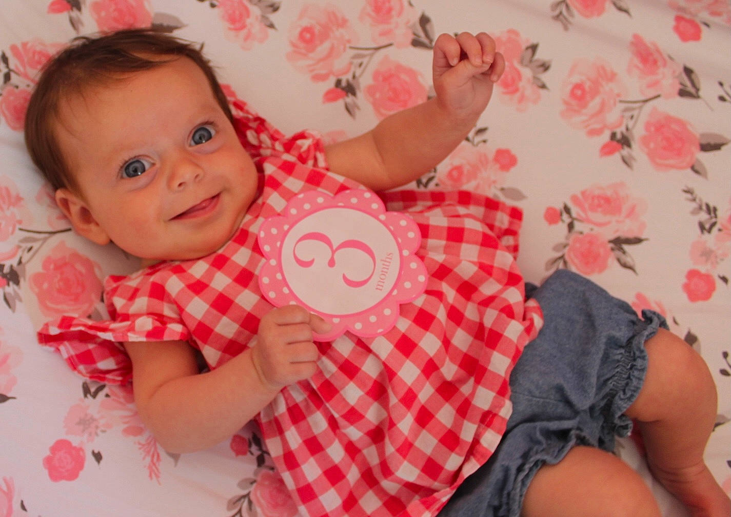 Ellie joined the competition — help win amazing prizes! arm, baby, baby_toddler_clothing, cheek, dress, finger, gesture, hand, happy, head, joy, pattern, person, pink, plaid, product, skin, sleeve, smile, textile