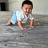 baby, child, crawling, smiling, white_shirt, blue_shorts, carpet, floor, indoor, hallway, person, cute, happy, young, infant, toddler, skin, hair, eyes, hands