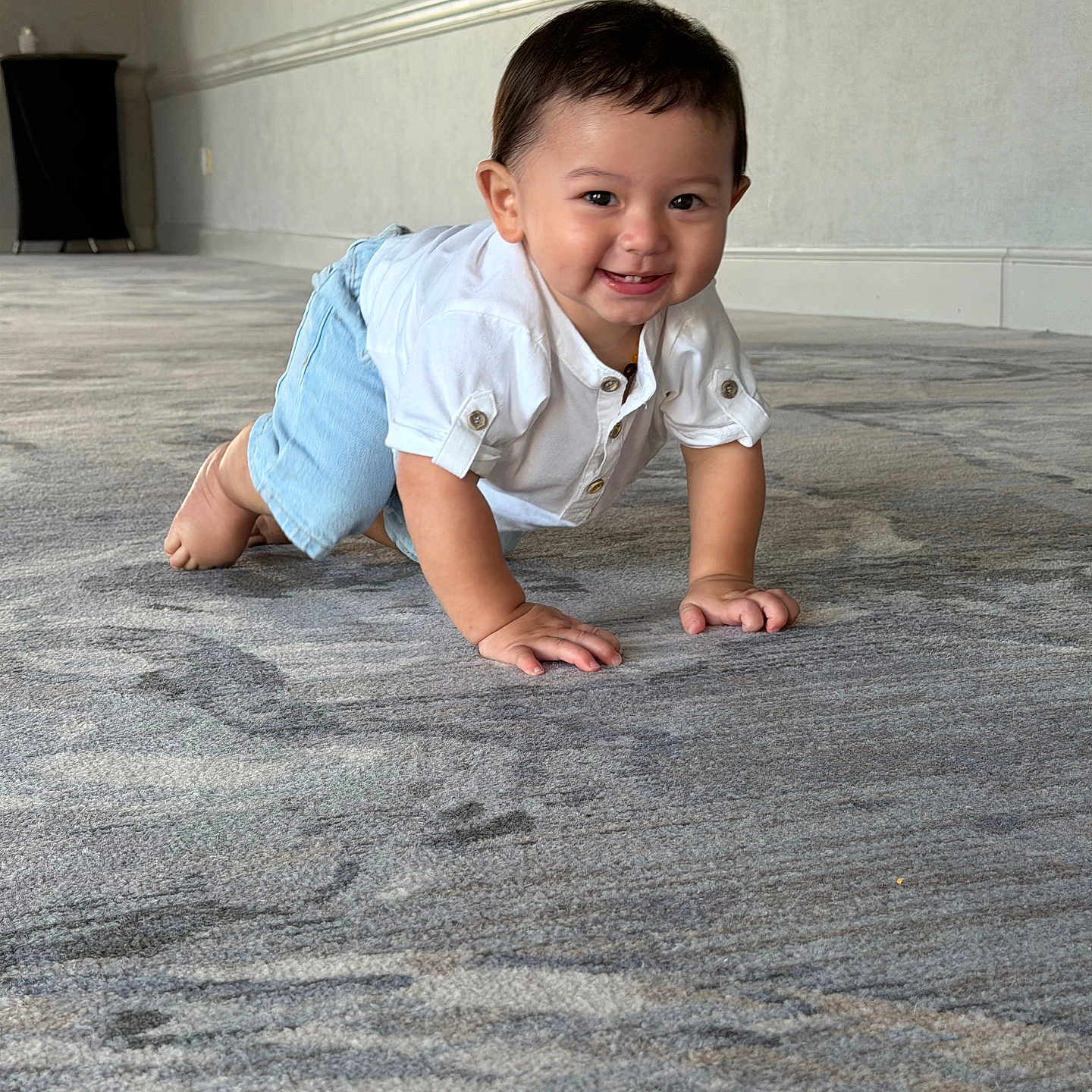 Raiden joined the competition — help win amazing prizes! baby, child, crawling, smiling, white_shirt, blue_shorts, carpet, floor, indoor, hallway, person, cute, happy, young, infant, toddler, skin, hair, eyes, hands