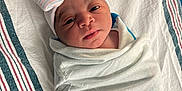 Jream joined the competition — help win amazing prizes! baby, bassinette, bed, blanket, bow, child, cute, face, hat, hospital, hospital_bed, infant, lying_down, newborn, newborn_baby, person, sleepwear, striped, swaddled, wrapped