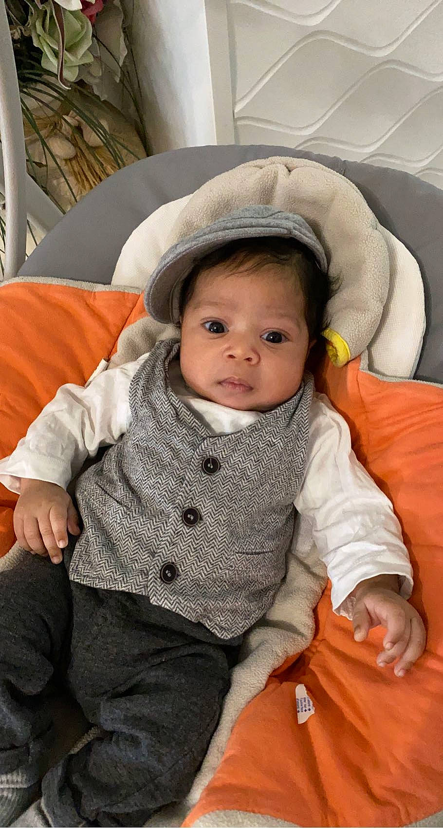 Nassim participe au concours pour gagner de l'argent avec cette photo : arm, baby, baby_toddler_clothing, cheek, child, chin, comfort, facial_expression, flooring, happy, iris, mouth, nose, organ, outerwear, person, product, sitting, skin, sleeve