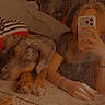 Mikko is registered to the contest to win money with this photo: dog, person, carpet, mirror, phone, selfie, indoor, bed, blanket, pillow, bracelet, hand, reflection, furniture, casual, relaxed, brown, striped, checkered, lighting