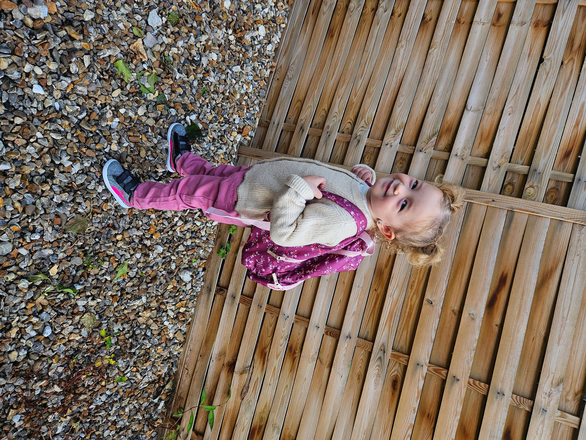 Mya participe au concours pour gagner de l'argent avec cette photo : baby, baby_toddler_clothing, child, grass, hardwood, joy, magenta, pattern, people_in_nature, person, purple, toddler, tree, wood