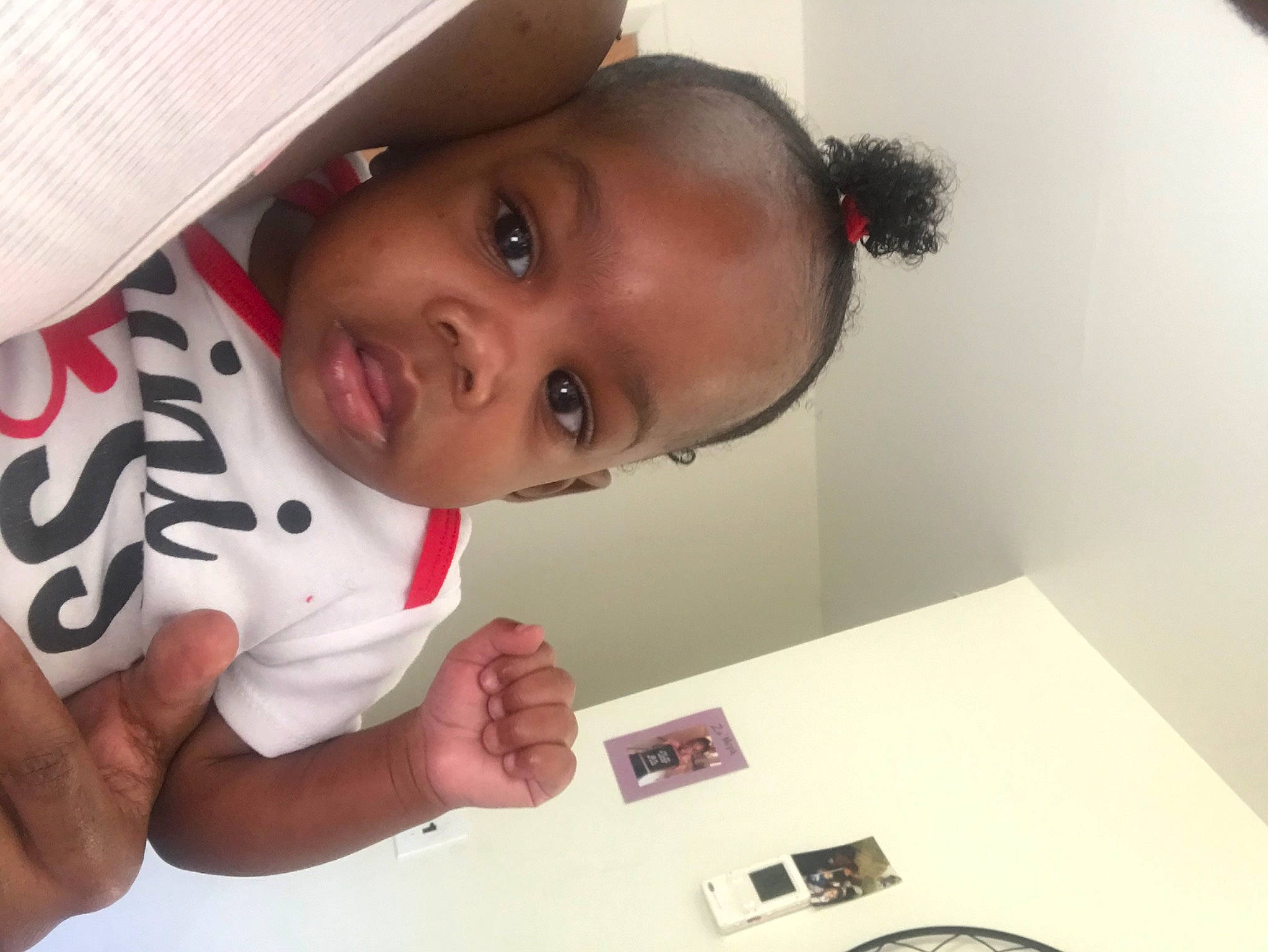 Kamilla is registered to the contest to win money with this photo: arm, baby, cheek, child, ear, electronic_device, eye, eyebrow, face, forehead, happy, head, mouth, nose, person, photography, selfie, skin, smile, toddler