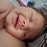 Mavis Rai is registered to the contest to win money with this photo: baby, bodypart, face, finger, hand, happy, head, mouth, newborn, person, photography, portrait, sleeping, smile