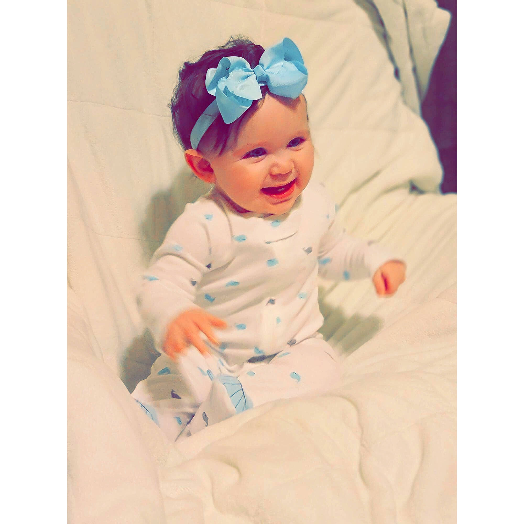 Dallas is registered to the contest to win money with this photo: baby, baby_products, baby_toddler_clothing, beanie, bonnet, cap, child, fashion_accessory, hair_accessory, headband, headgear, headpiece, headwear, person, pink, product, sleeve, t_shirt, textile, toddler