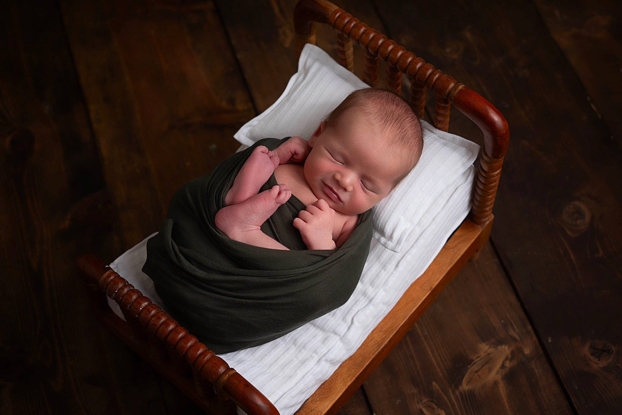 Holden is registered to the contest to win money with this photo: baby, baby_products, baby_safety, baby_toddler_clothing, brown, child, comfort, flash_photography, flooring, hardwood, infant_bed, linens, nap, person, room, sitting, toddler, varnish, wood, wood_flooring