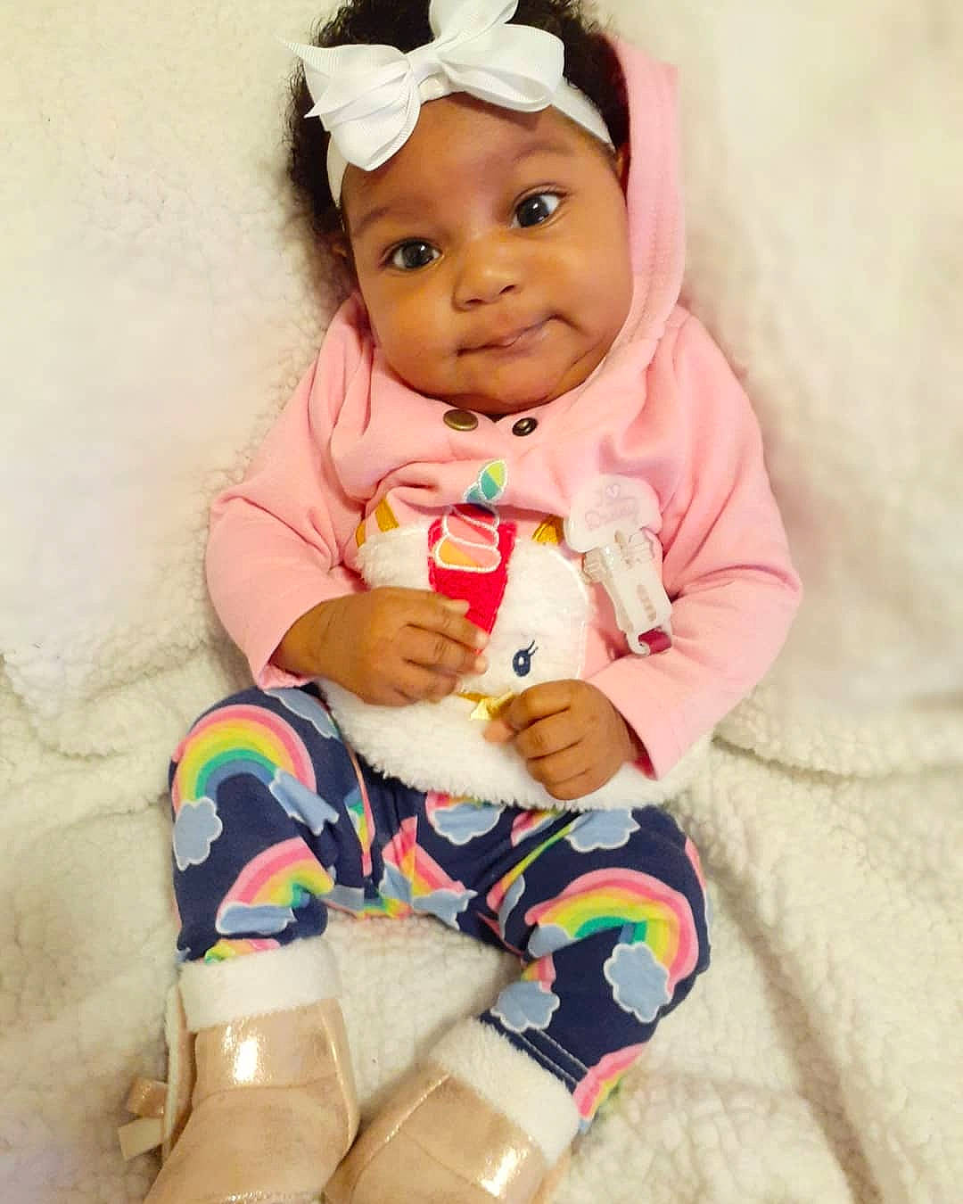 Ta'Nyla Hill joined the competition — help win amazing prizes! baby, baby_toddler_clothing, cheek, child, doll, headwear, person, pink, play, sitting, skin, smile, toddler, toy