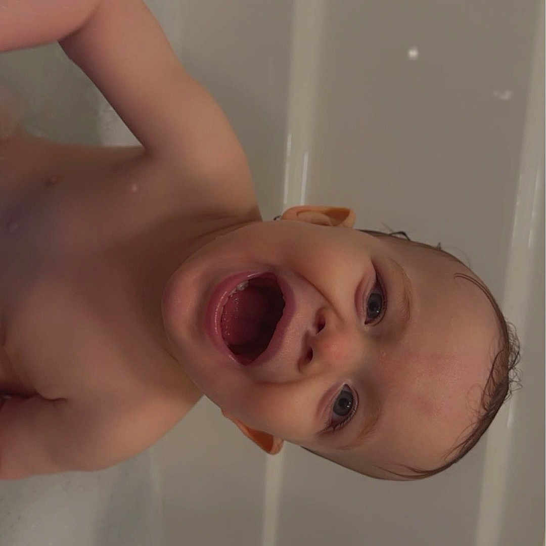 Madden joined the competition — help win amazing prizes! baby, babylaughing, bathing, bathroom, bathtub, bodypart, face, happy, head, indoors, laughing, mouth, person, photography, portrait, room, symbol, teeth, tub, yawning