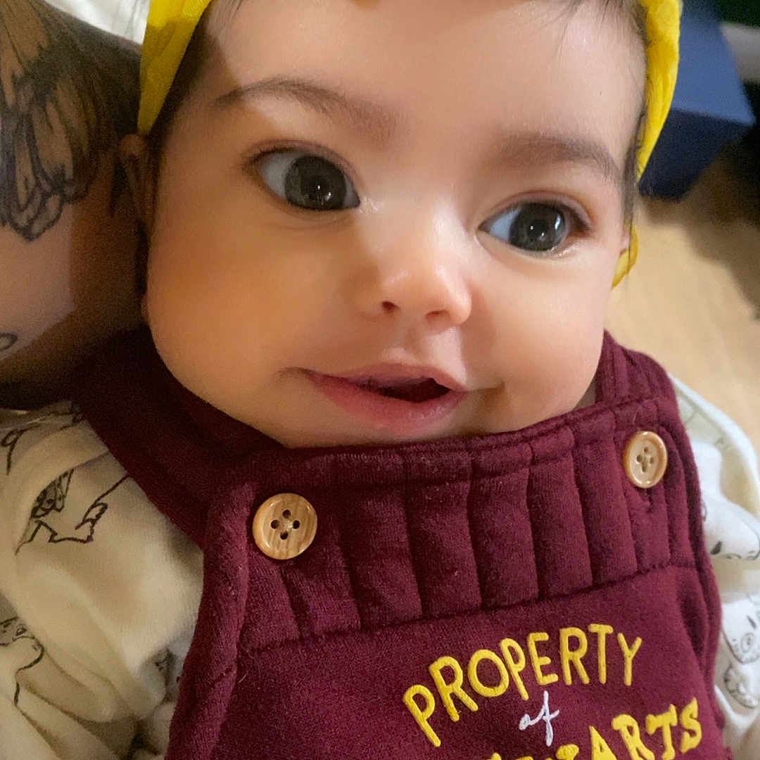 Aerowyn is registered to the contest to win money with this photo: accessories, baby, baseballcap, bonnet, cap, clothing, coat, costume, face, hat, head, headband, jacket, knitwear, person, photography, portrait, skin, sweater, vest