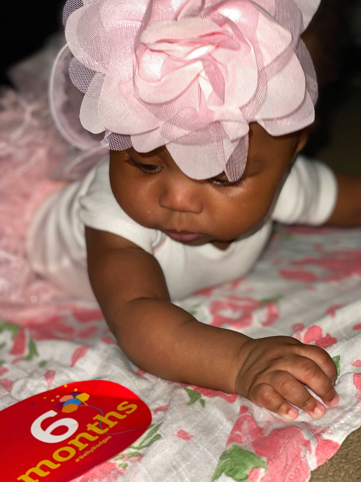 Nairobi joined the competition — help win amazing prizes! baby, baby_toddler_clothing, beauty, carmine, child, event, face, fashion_accessory, flower, hair_accessory, happy, headgear, headpiece, headwear, linens, pattern, peach, person, petal, pink