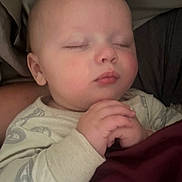 Carter joined the competition — help win amazing prizes! baby, sleeping, infant, hands, clasped, pajamas, blanket, face, peaceful, child, closeup, skin, head, person, resting, indoors, soft, cozy, cute, portrait
