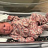 Tiana joined the competition — help win amazing prizes! newborn, baby, infant, child, floral_outfit, pink_clothing, bassinet, hospital, blanket, lying_down, portrait, face, eyes, awake, cute, indoors, medical_setting, baby_clothes, swaddling, photography