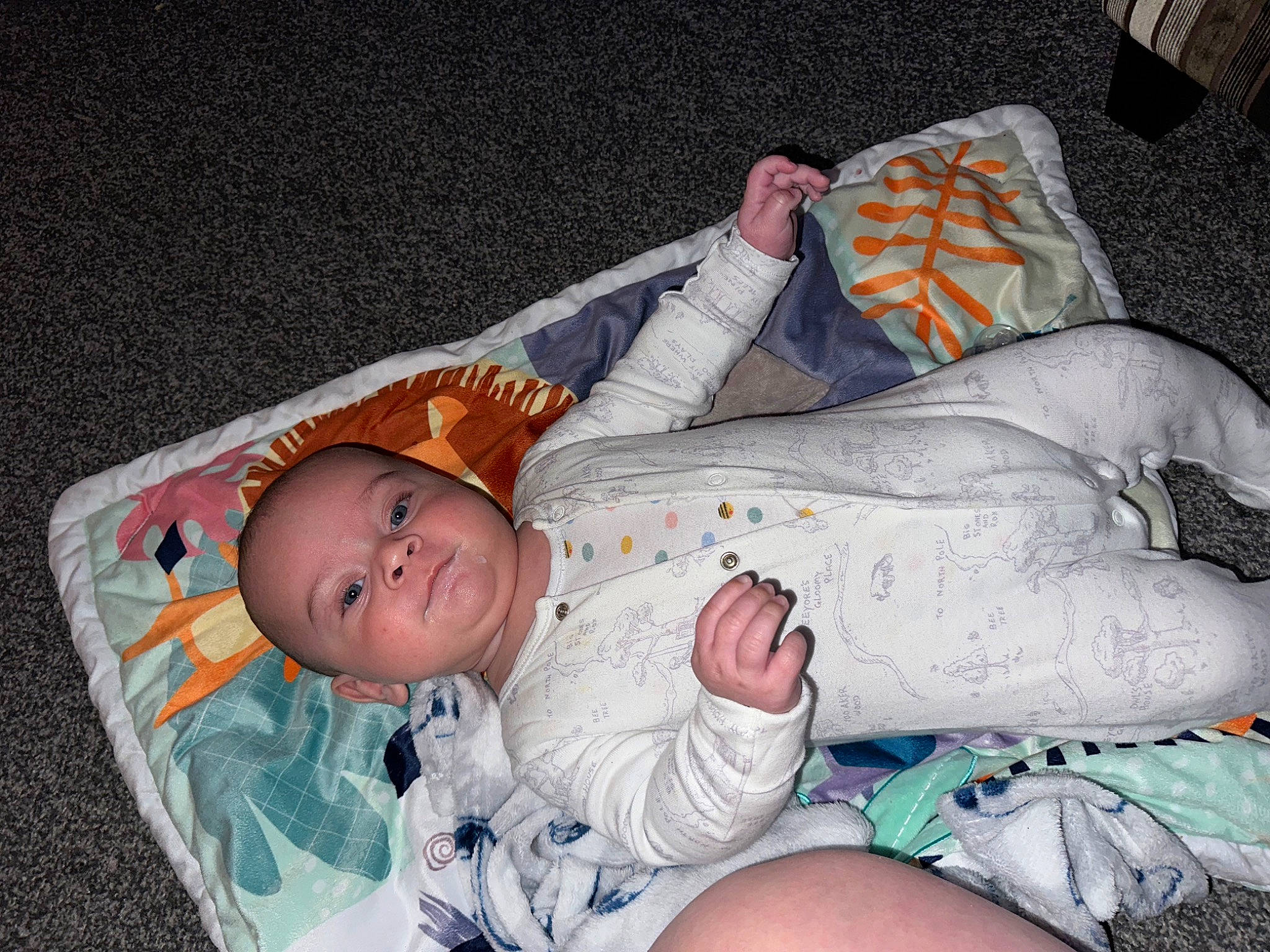 Enzo is registered to the contest to win money with this photo: abdomen, baby, baby_products, baby_toddler_clothing, bedtime, child, comfort, face, foot, head, human_leg, linens, nap, pattern, person, room, sitting, sleep, smile, thigh