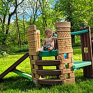 Dennis joined the competition — help win amazing prizes! child, toddler, playground, play_structure, plastic, castle, outdoor, grass, trees, sky, sunny, greenery, barefoot, shirtless, nature, summer, daylight, young, curious, person