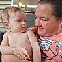 Dennis joined the competition — help win amazing prizes! child, toddler, woman, face, person, outdoor, window, house_siding, shirtless, smile, hair, skin, holding, interaction, family, gaze, adult, casual, expression, closeup