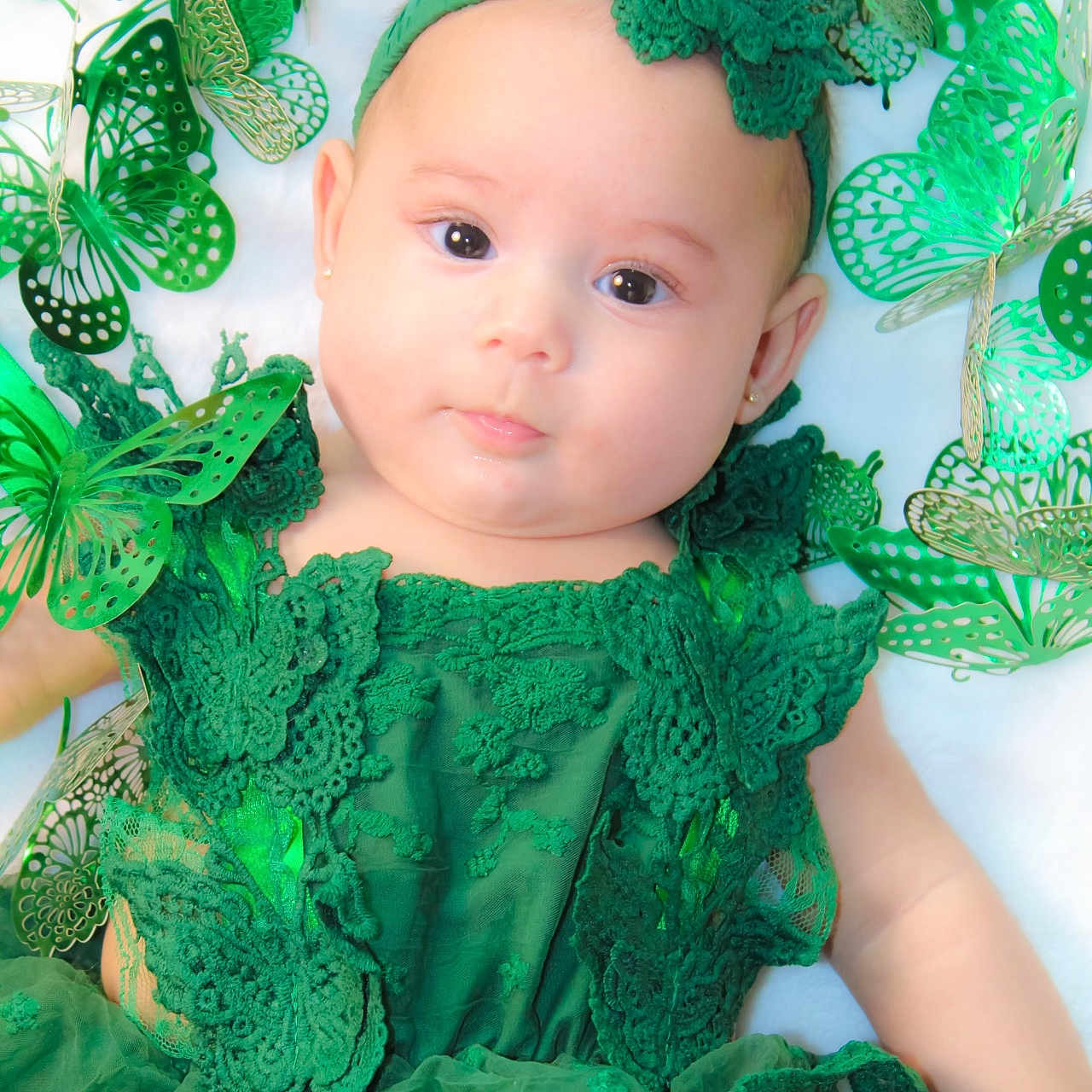 Queen Armani is registered to the contest to win money with this photo: accessories, baby, blouse, bonnet, clothing, costume, doll, dress, elf, face, glasses, green, hat, head, jewelry, lace, person, photography, portrait, toy