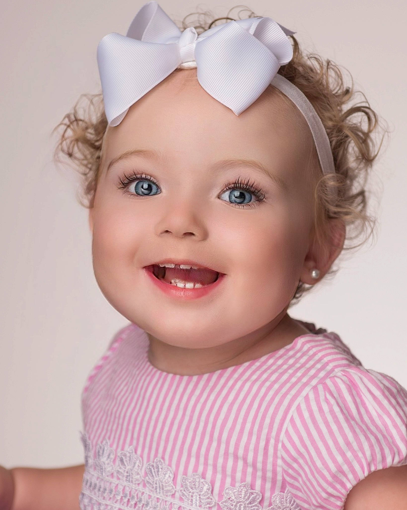 Libby is registered to the contest to win money with this photo: baby_toddler_clothing, blond, brown_hair, costume_hat, ear, electric_blue, eye, eyelash, hair_accessory, happy, headband, headgear, headpiece, headwear, iris, joy, lip, magenta, person, pink