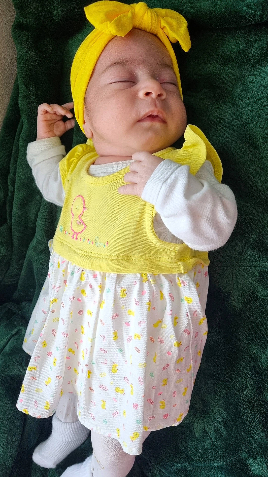 Lucie a rejoint le concours — aidez-le/la à gagner de superbes lots ! arm, baby, baby_products, baby_toddler_clothing, cheek, child, day_dress, dress, face, happy, headgear, linens, one_piece_garment, pattern, person, pink, skin, sleeve, textile, toddler