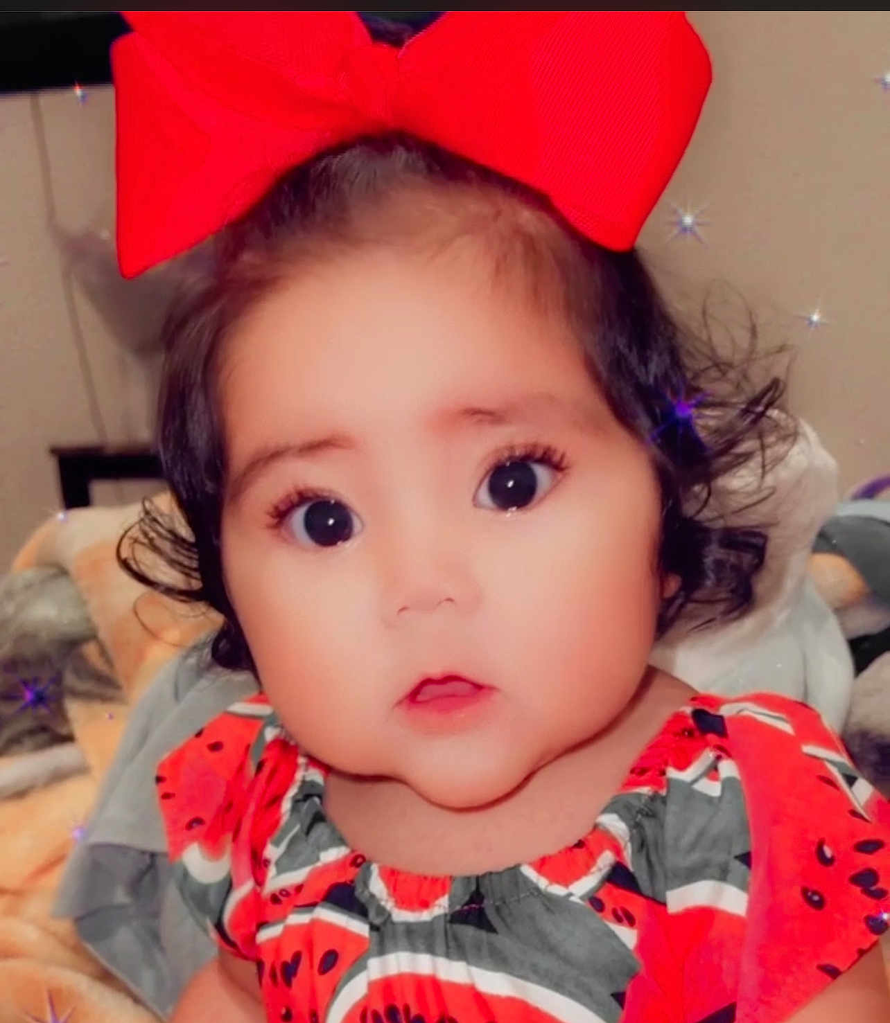 Jamila Vega is registered to the contest to win money with this photo: accessories, baby, bodypart, bowtie, clothing, dress, face, formalwear, frown, happy, head, headband, people, person, photography, portrait, sad, shoulder, smile, tie