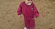 Cali joined the competition — help win amazing prizes! toddler, child, pacifier, tracksuit, maroon_clothing, nike_logo, shoes, pink_shoes, outdoor, sand, sidewalk, curious, standing, young_child, casual_clothing, short_hair, daylight, person, ground, walking_area