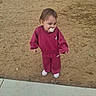 toddler, child, pacifier, tracksuit, maroon_clothing, nike_logo, shoes, pink_shoes, outdoor, sand, sidewalk, curious, standing, young_child, casual_clothing, short_hair, daylight, person, ground, walking_area
