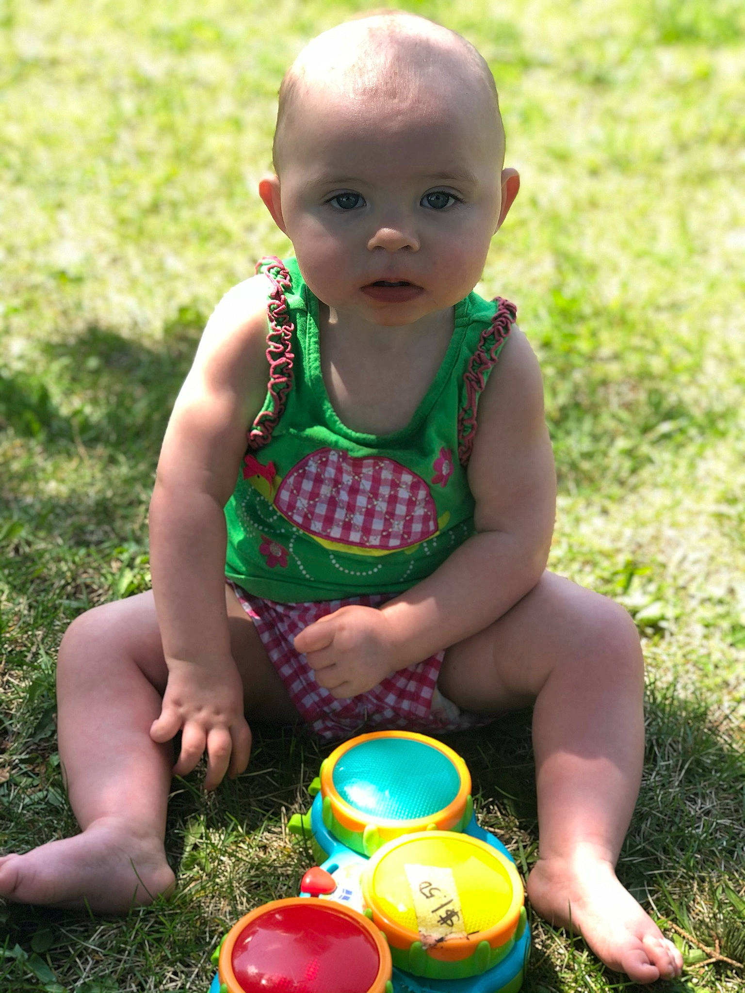 Danica joined the competition — help win amazing prizes! baby, baby_toddler_clothing, chair, child, face, fun, grass, happy, idiophone, leisure, people_in_nature, person, photograph, recreation, shorts, sitting, smile, summer, thigh, toddler