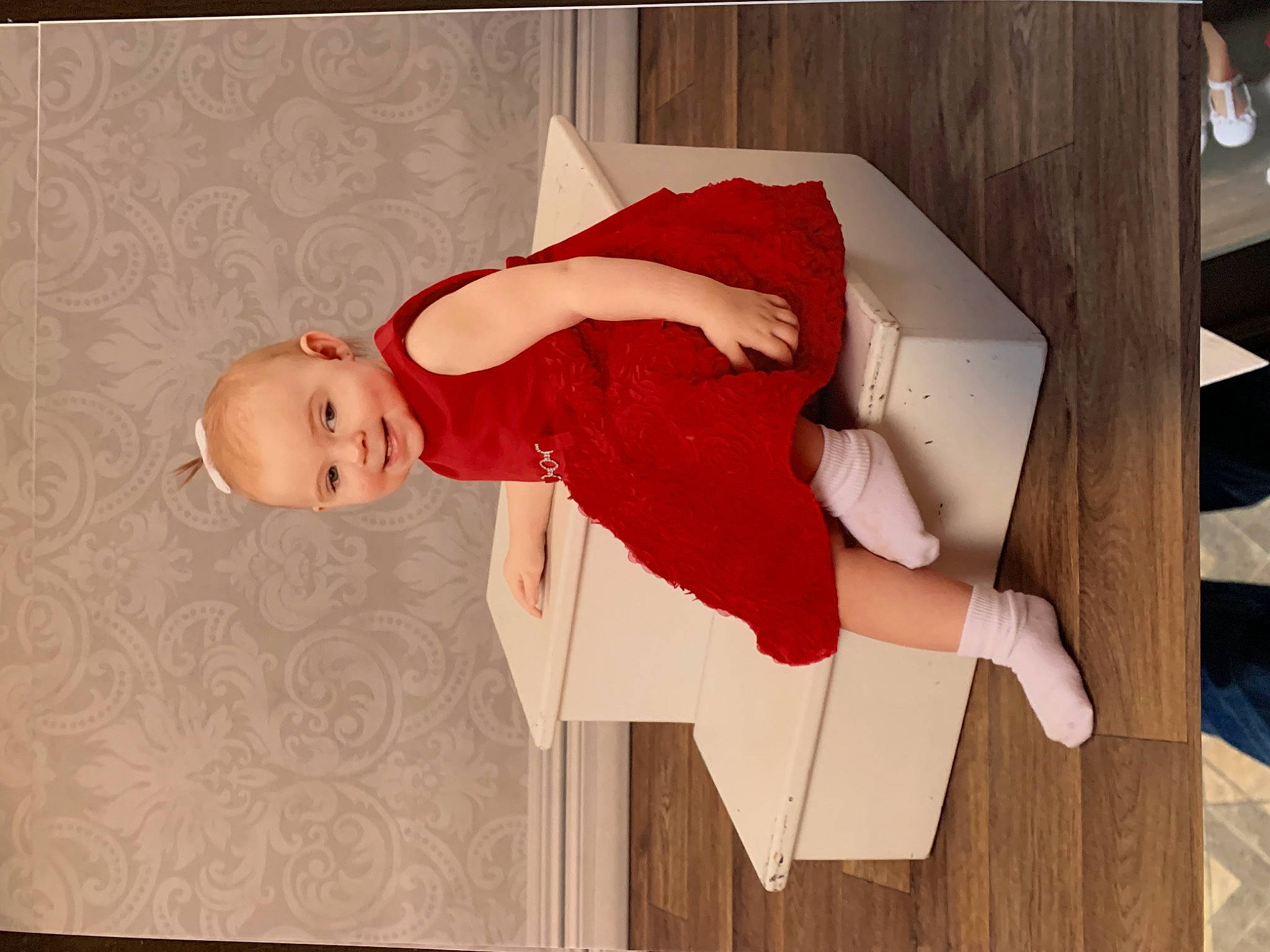 Danica is registered to the contest to win money with this photo: baby, carmine, child, comfort, elbow, flesh, flooring, foot, happy, hardwood, human_leg, joy, knee, person, room, sleeve, thigh, toddler, varnish, wood