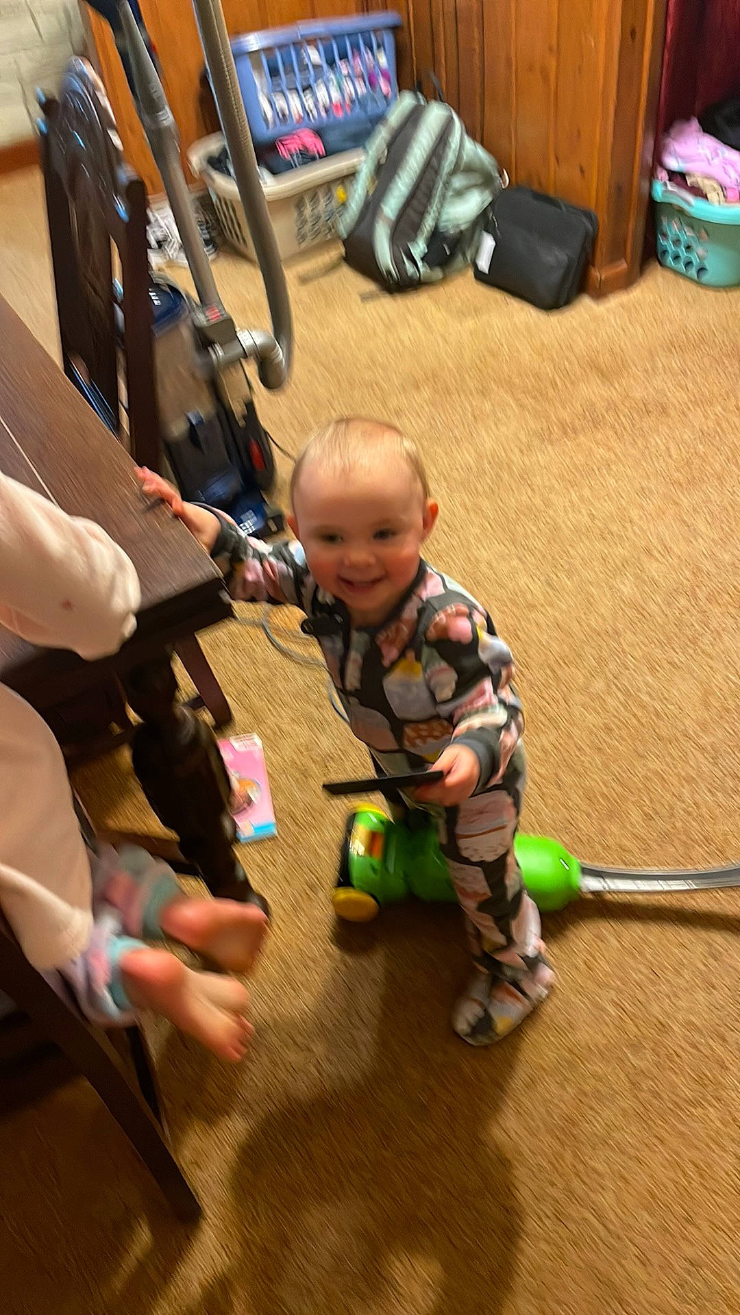 Danica is registered to the contest to win money with this photo: baby, baby_carriage, baby_products, bag, child, floor, flooring, fun, hand, hardwood, joy, luggage_and_bags, mammal, people, person, sitting, skin, smile, toddler, toy