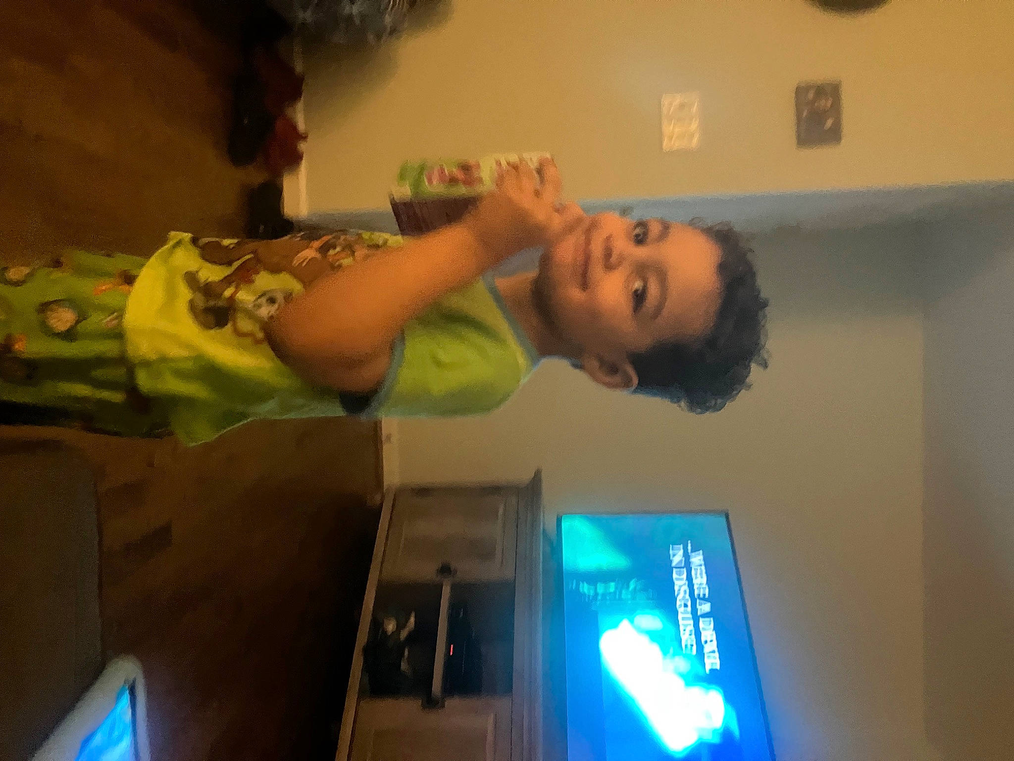 Julian is registered to the contest to win money with this photo: baby, ceiling, child, display_device, elbow, fun, gadget, happy, joy, machine, person, room, smile, t_shirt, television_set, toddler