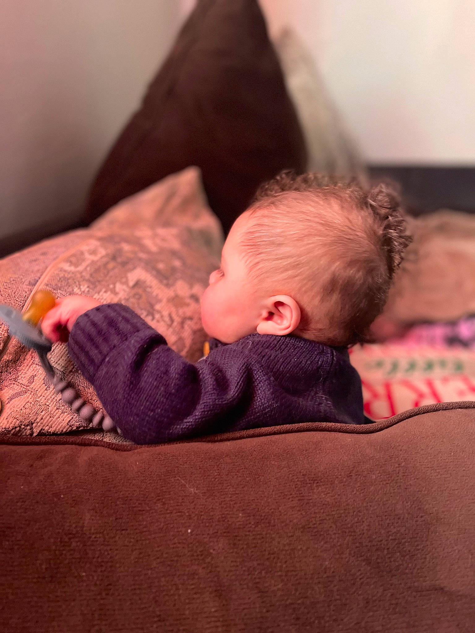Montgomery is registered to the contest to win money with this photo: baby, baby_sleeping, baby_toddler_clothing, bedding, bedtime, carmine, child, comfort, flooring, human_leg, linens, mammal, nap, person, room, sitting, sleeve, t_shirt, textile, toddler