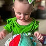 Azura is registered to the contest to win money with this photo: toddler, child, green_clothing, headband, bow, plush_toy, indoor, carpet, playing, curious, face, hands, soft_toy, baby, cute, closeup, childhood, smiling, happy, home