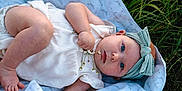 Harper joined the competition — help win amazing prizes! baby, blue_eyes, headband, blanket, grass, flower, infant, outdoor, cute, child, nature, greenery, peaceful, soft, cloth, portrait, young, lying_down, skin, toddler
