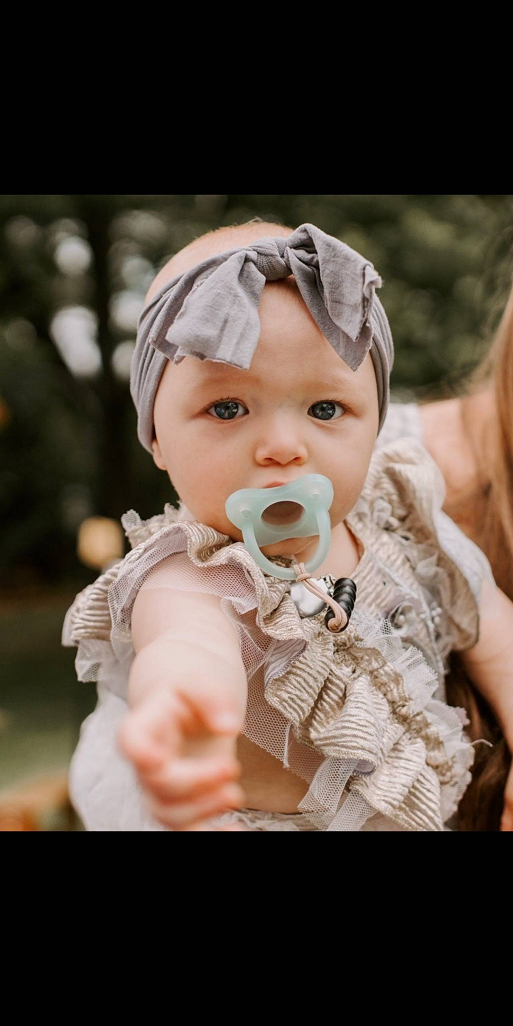 Haylee joined the competition — help win amazing prizes! baby, baby_toddler_clothing, cap, cheek, child, event, eyewear, face, fashion_accessory, flash_photography, fun, gesture, grass, happy, headpiece, headwear, iris, peach, person, sitting