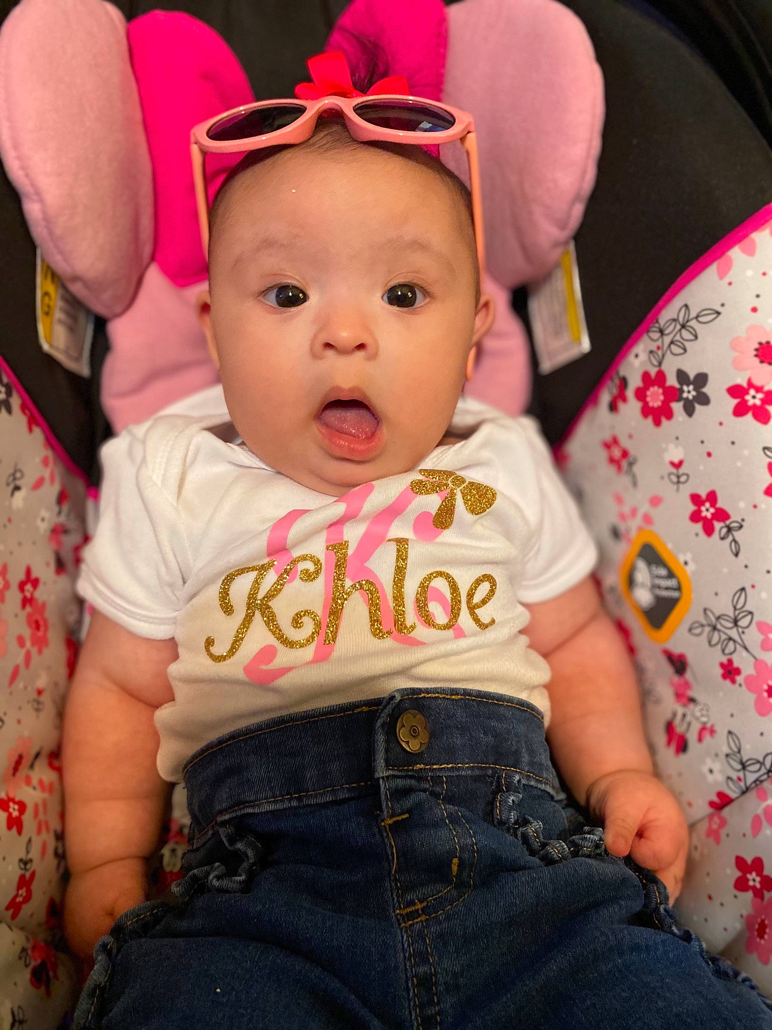 Khloe is registered to the contest to win money with this photo: baby, baby_toddler_clothing, cap, cheek, child, clothing, comfort, costume_hat, fun, happy, human_body, iris, magenta, mouth, organ, person, pink, skin, sleeve, surprise