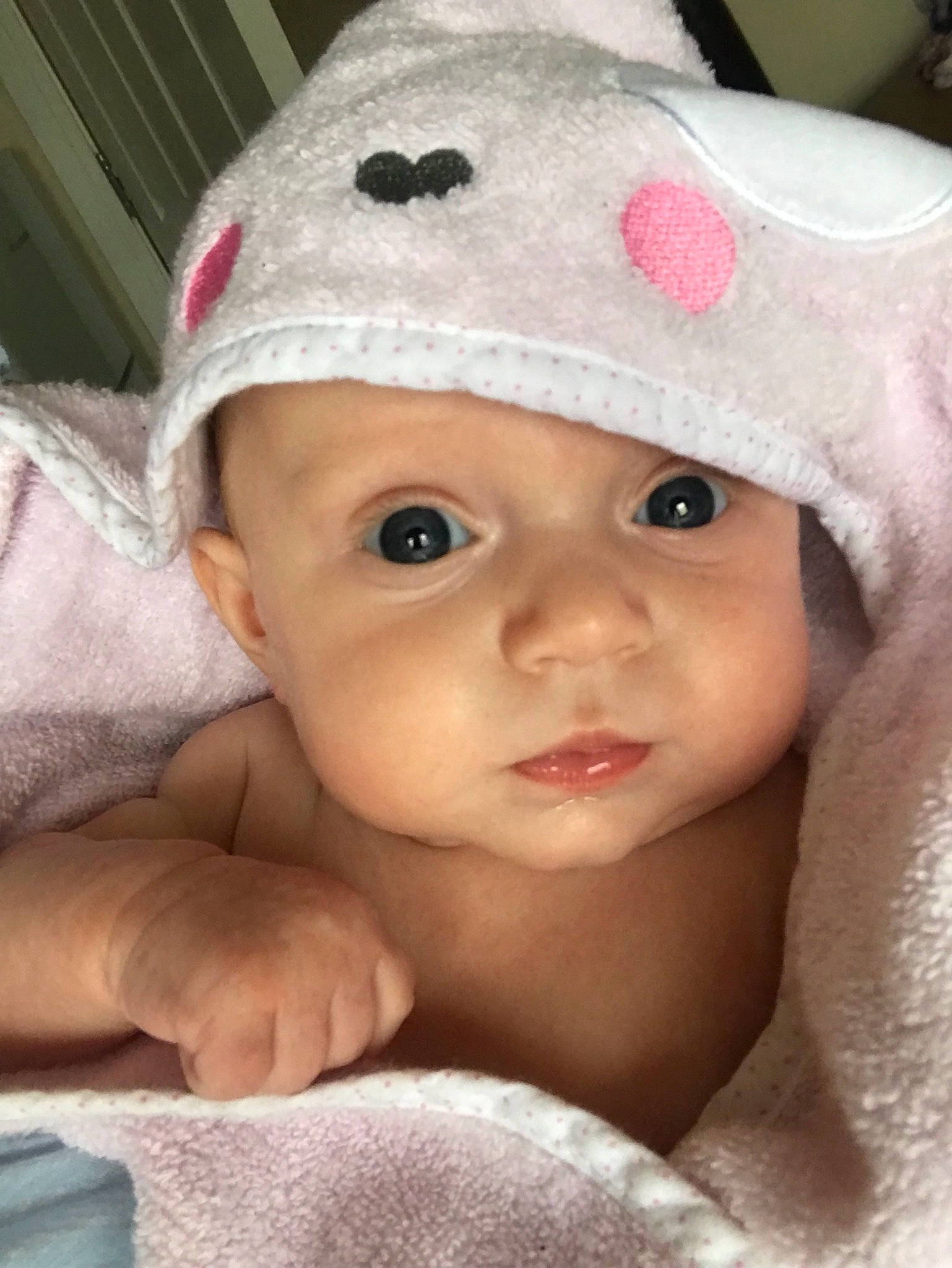 Lois is registered to the contest to win money with this photo: baby, cheek, child, eye, face, head, headgear, headwear, linens, lip, person, pink, skin, toddler